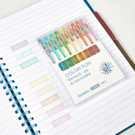 Retractable fine-point gel pens set with clear plastic case and coral tone colors