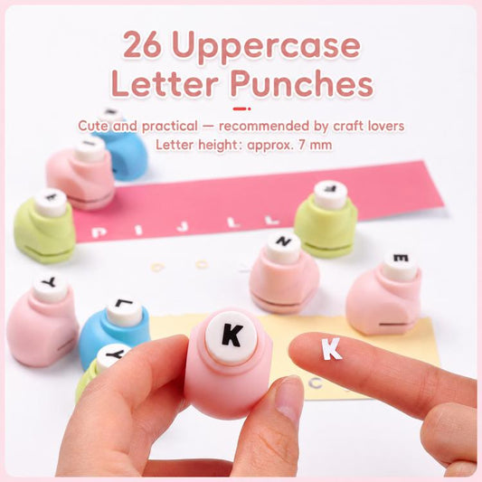 Close view of pastel uppercase letter punch heads with hands arranging punches