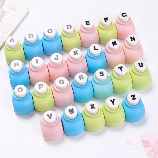 Pastel uppercase letter punch heads with raised A–Z characters