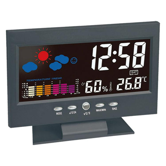 Black LCD weather clock with backlit time display and temperature & humidity readouts.