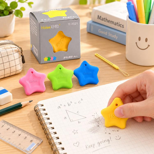 Set of four colorful star-shaped erasers with lanyards on a desk