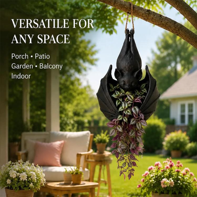 Hanging bat-shaped plant pot with long dangling purple foliage and black bat body