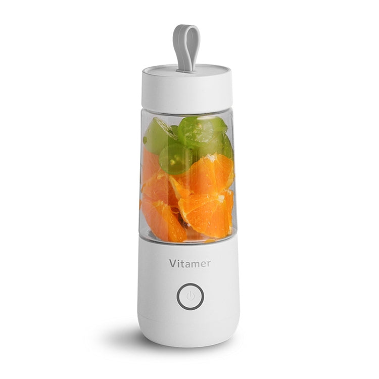 Vitamer mini portable juicer blender, white bottle with clear top and fruit inside