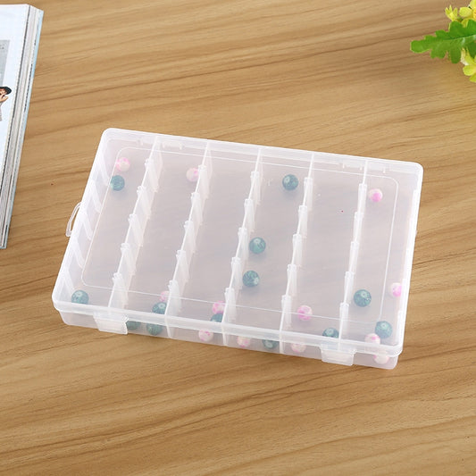 Transparent organizer box with hinged lid and 36 grid compartments with small beads