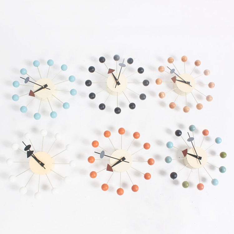 Set of decorative ball wall clocks with cream faces, mixed arm colors and hands