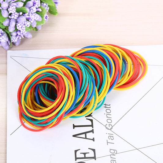 Coiled multicolor elastic rubber bands on a printed card