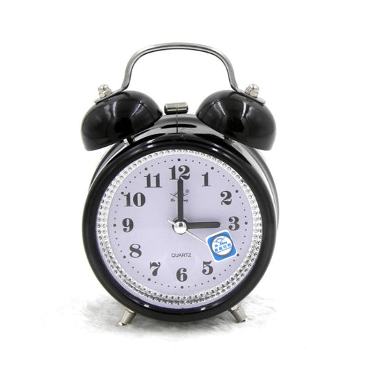 Black metal twin bell alarm clock with analog dial, quartz text, and blue night-light icon.