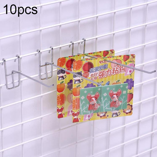 Metal supermarket grid shelf hooks holding colorful cards on a wire grid