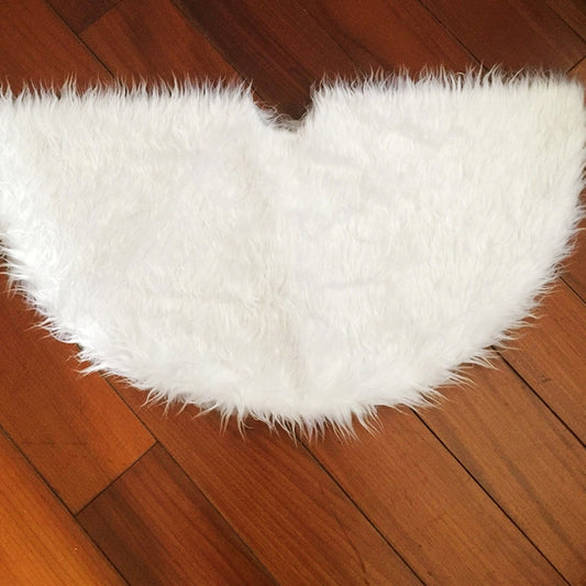 White plush half-moon tree skirt with fluffy shag pile and curved edge