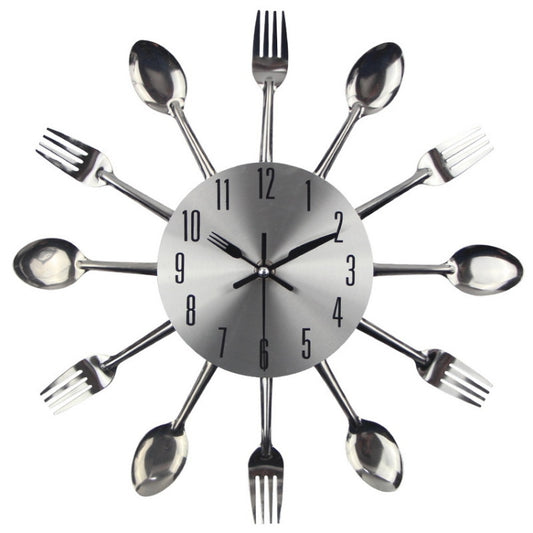 Silver utensil wall clock with round gray dial, black hands, and black hour marks