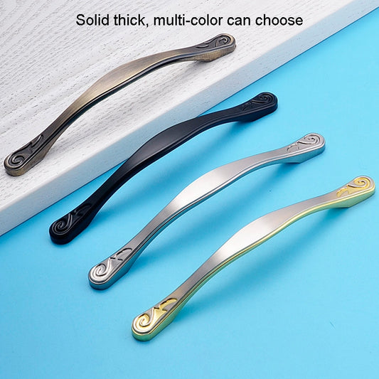 Set of curved cabinet handles in black, silver, and gold with swirl end caps