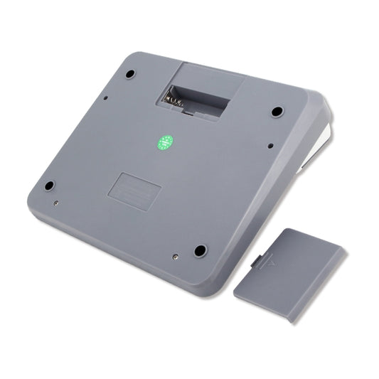 Back of a desktop calculator with battery compartment door and small indicator light