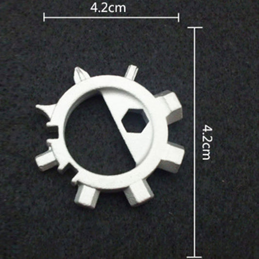 Silver gear-style keychain tool with loop ring and visible hex bit