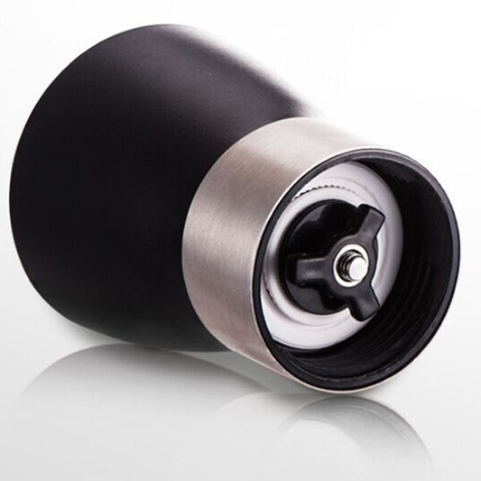 Close-up of conical burr grinder base with stainless housing and black center knob