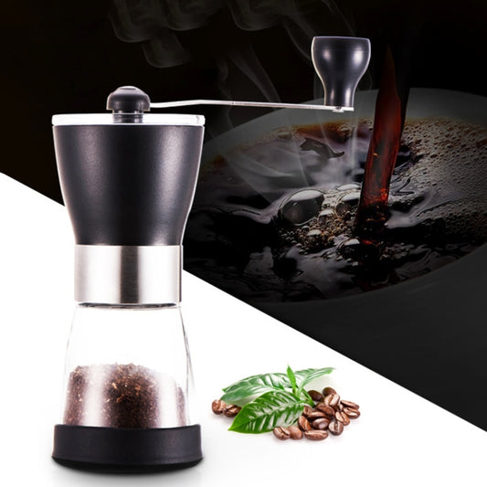 Manual conical burr grinder with black top and stainless body, filled with ground coffee
