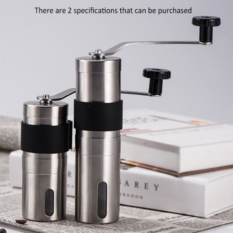 Stainless steel manual coffee bean grinder with black crank handle and knob