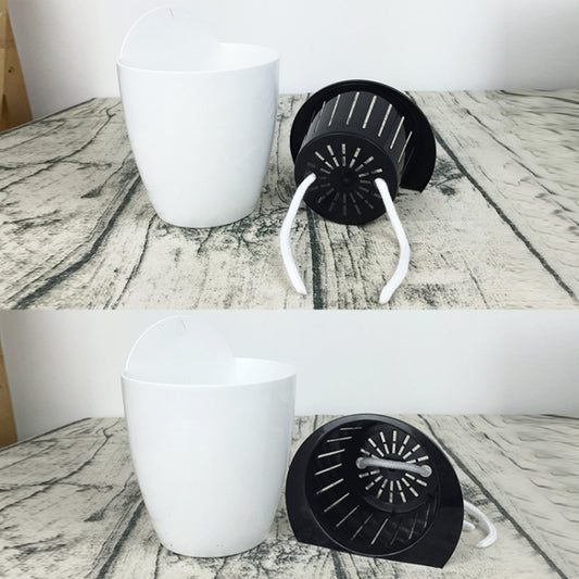 White round self-watering wall planter with black perforated planting basket