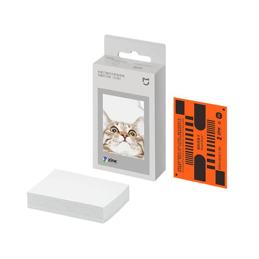 Pocket photo printer paper pack with stacked photo sheets and sample print