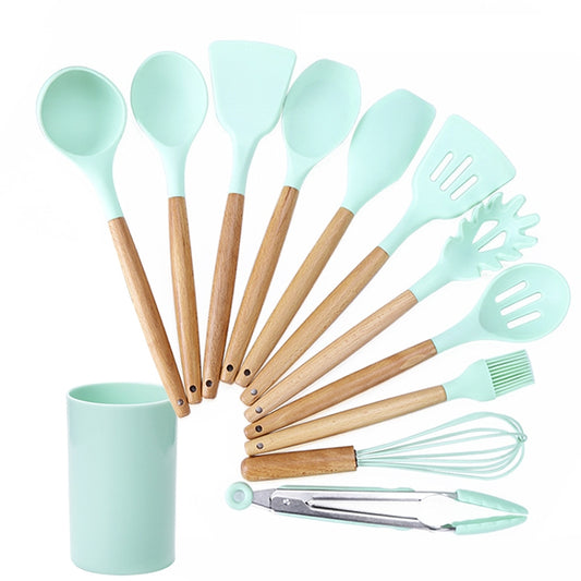 Green silicone kitchen tool set with wooden handles, 11 pieces, in a storage bucket