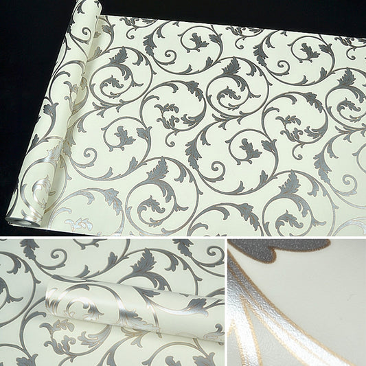 Damask wallpaper sheet corner, cream with dark gray floral swirls and glossy finish