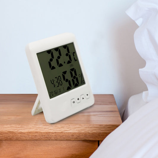 White digital indoor thermometer hygrometer with tilting stand, showing temperature and humidity