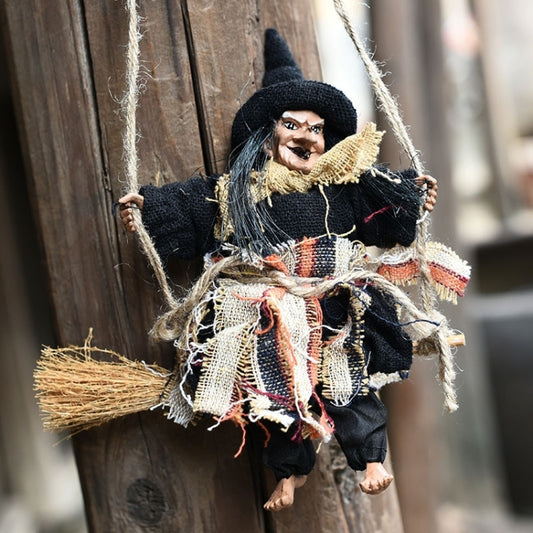 Halloween witch hanging ornament with broom, black hat, ragged black outfit and straw details