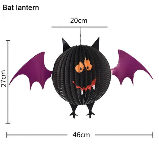Black bat paper lantern with purple wings and orange spooky face, hanging decoration