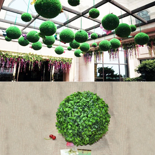 Artificial green plant ball topiary ornament with dense rounded foliage