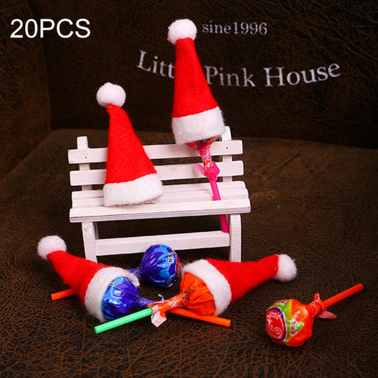 Mini red felt Santa hats with white trim and pom on candy lollipop sticks