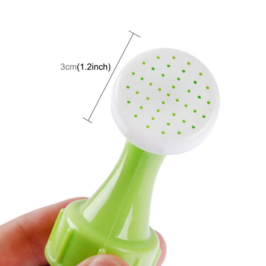 Water spray nozzle head with white perforated mist disc and green base