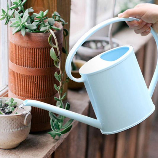 1.3L plastic watering can with long spout and curved handle, light blue