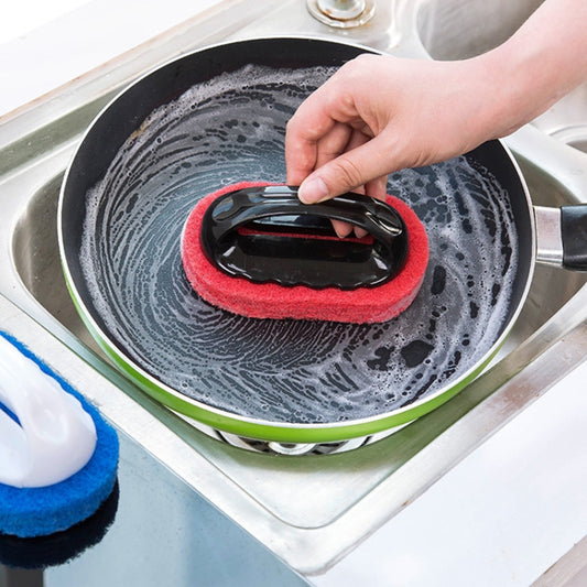 Hand scrubbing a pan with a red sponge cleaning brush and hard black base for wet cleaning