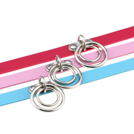 Closeup of leather choker collars in multiple colors with silver dual rings