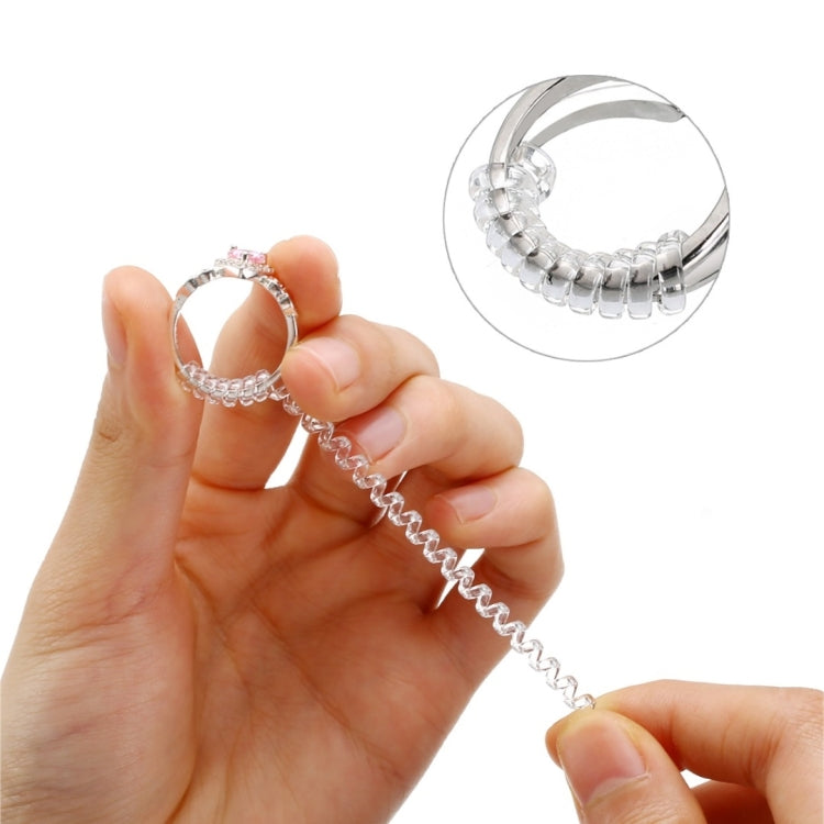 Ring size reducer tool held in hand with spiral chain for resizing