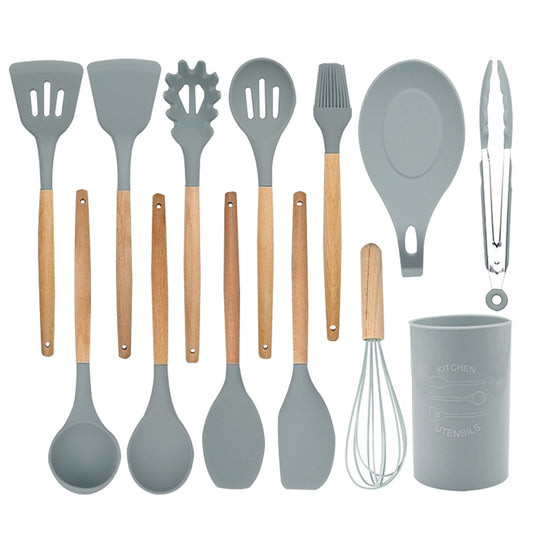 13-piece silicone cooking utensil set with light wood handles and gray storage container