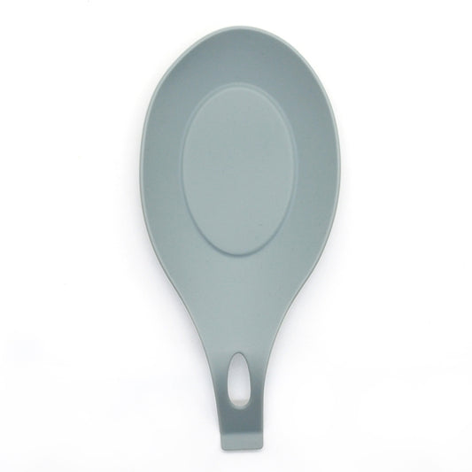 Light gray silicone spoon rest with oval center pad and handle holder