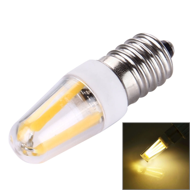 E14 LED bulb with clear glass and warm yellow filament, silver screw base
