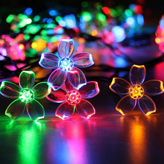 Cherry blossom LED flower lights, close-up of multicolor blossom bulbs on wire