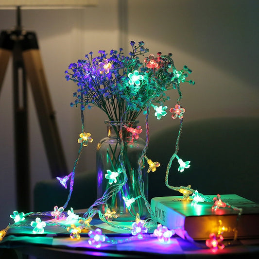 Colorful cherry blossom LED light string in clear vase, multicolor flower bulbs