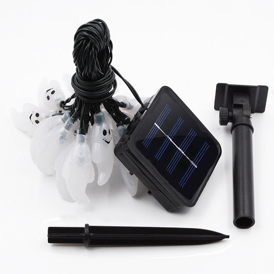 Solar panel stake, black cable, and white ghost-shaped LED bulbs bundle