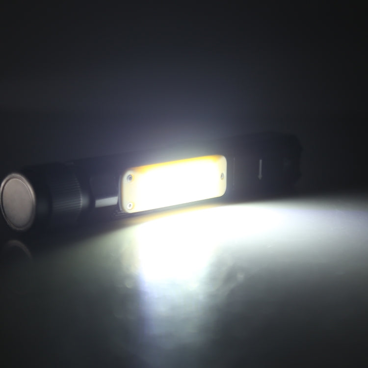 Black LED flashlight glowing with a bright COB panel and wide light beam