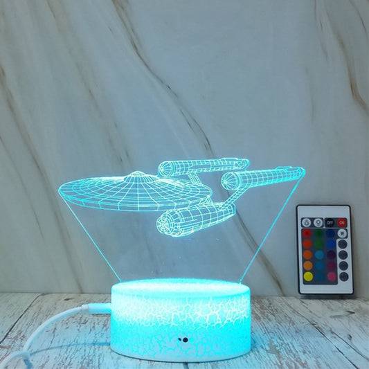 Spaceship-shaped night light with blue crackle glow, wireframe top, and touch remote