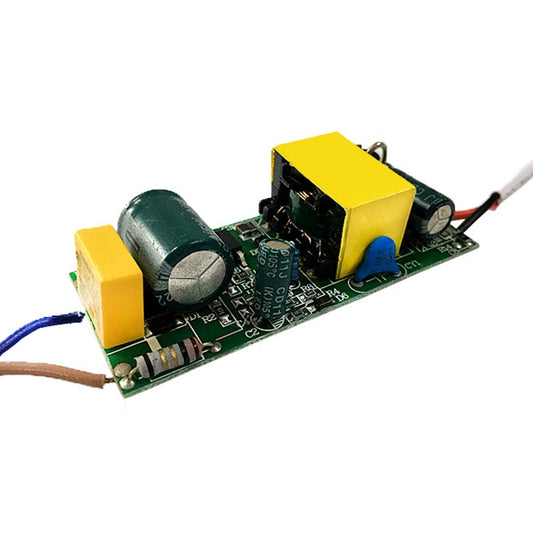 Isolated LED driver PCB with yellow transformer, green capacitor, and input/output wires