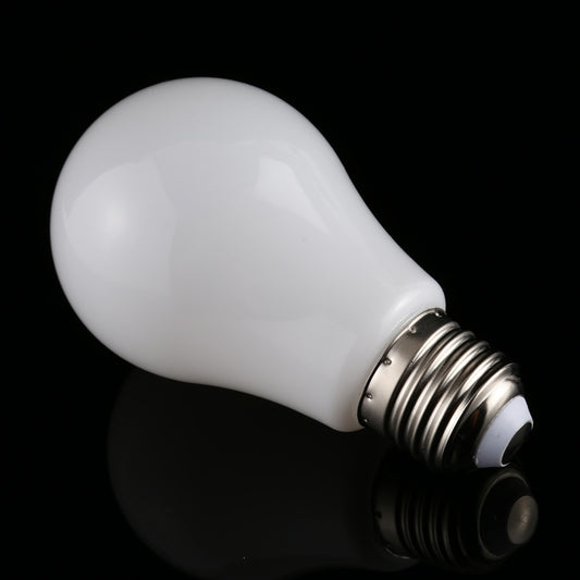 LED bulb with E27 screw base and frosted glass bulb, close-up side view