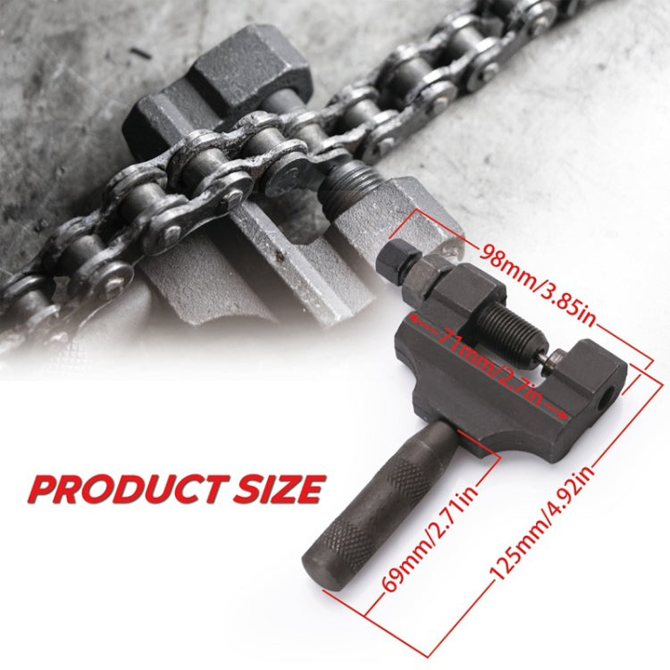 Chain removal tool pressing onto a metal chain link with clamp jaws and handle