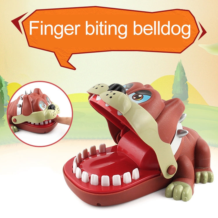 Dog-shaped finger bite toy with open red mouth, cream jaw, and white teeth.