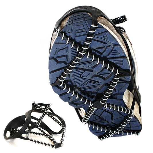 Blue sneaker with black-and-silver snow claw crampon traction on textured sole