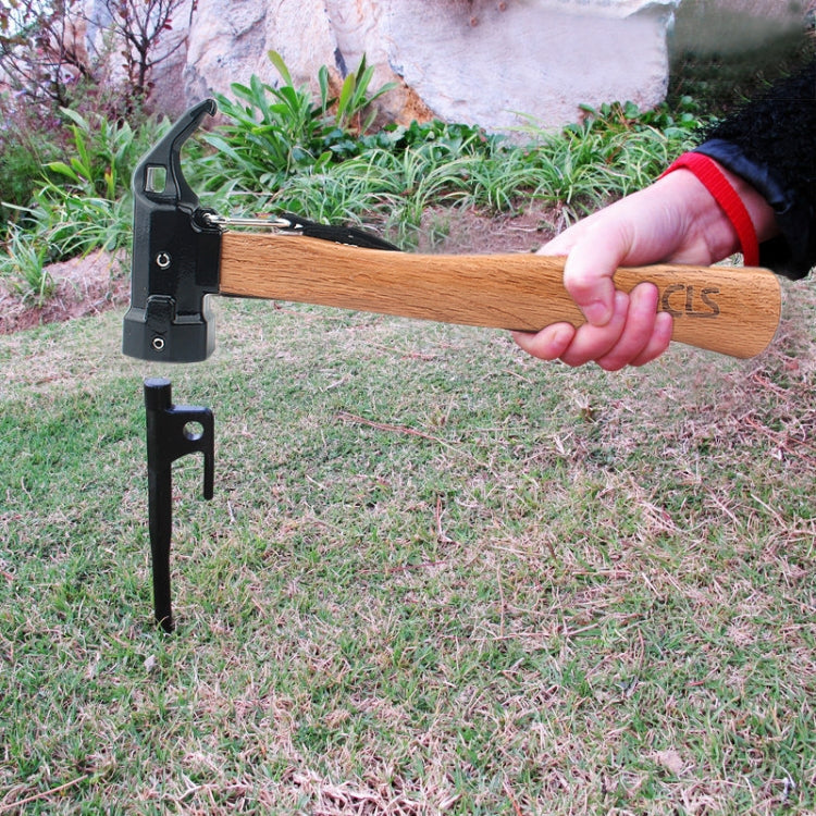 Shark-style nail puller hammer with black head and wooden handle in outdoor use