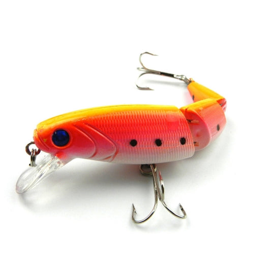 Orange and white hard plastic fishing lure with treble hooks and clear tail fins