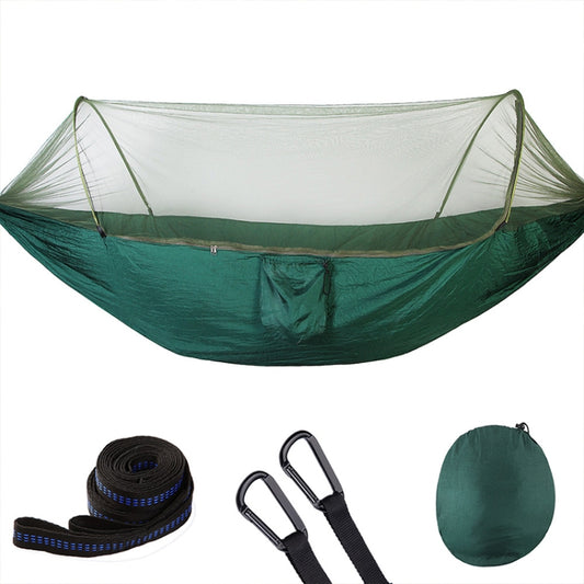 Green parachute hammock with mosquito net and included rope/strap accessories